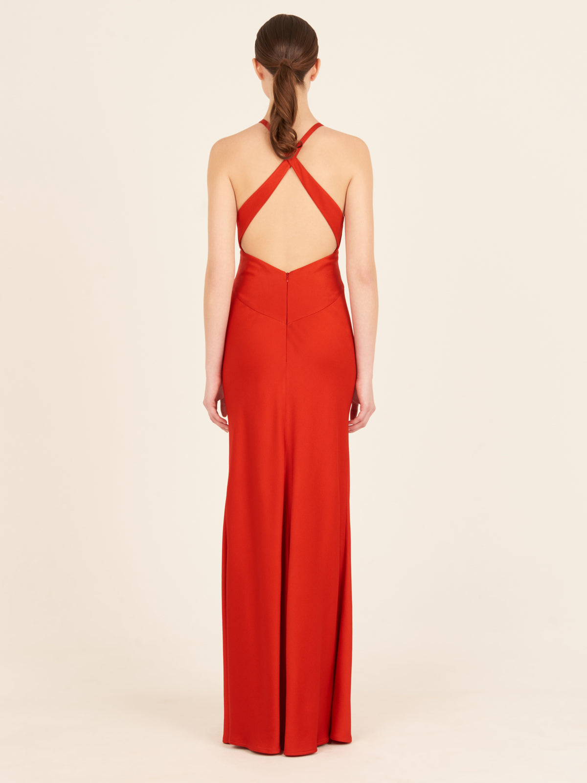 A Daniela Dress Rouge with a halter neck.
