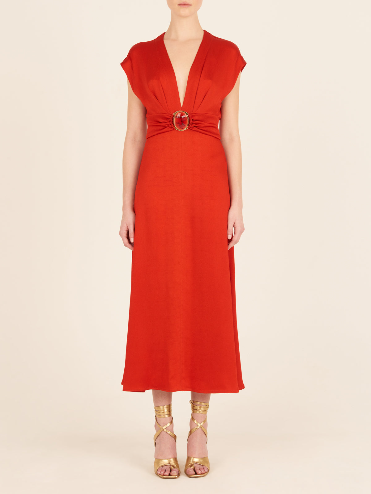 Emmeline Dress Rouge, with a belt that features a plunging neckline.