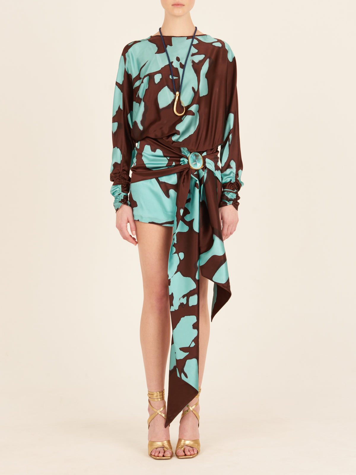 A Mallorca Dress Celeste Cacao with a black and blue floral print.