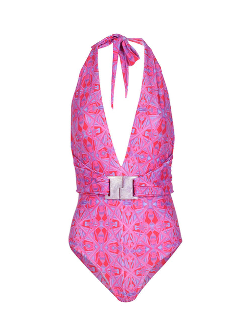 A Germain Bodysuit Magenta one-piece swimsuit featuring a magenta and purple pattern, deep V-neckline, halter tie, and a white belt buckle at the waist, exuding the signature style reminiscent of Silvia Tcherassi.