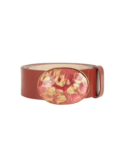 A Irene Belt Camel with a vibrant resin buckle in red and yellow. Made of Italian leather, this accessory is both stylish and durable.