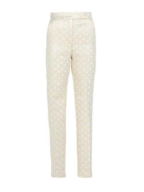 A pair of Orion Pant Gold Inverted with polka dots.