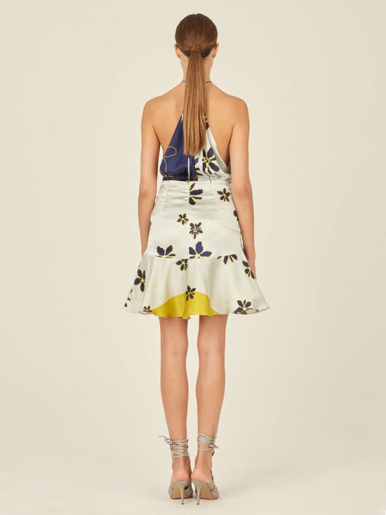 This Loriana Skirt Navy Citrine is made of floral fabric and features an invisible zipper.