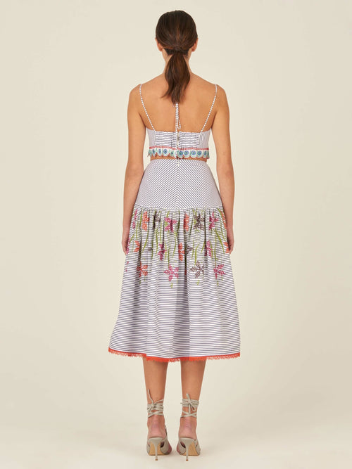 A Rosella Skirt Blue Pinstripe with floral embroidery.