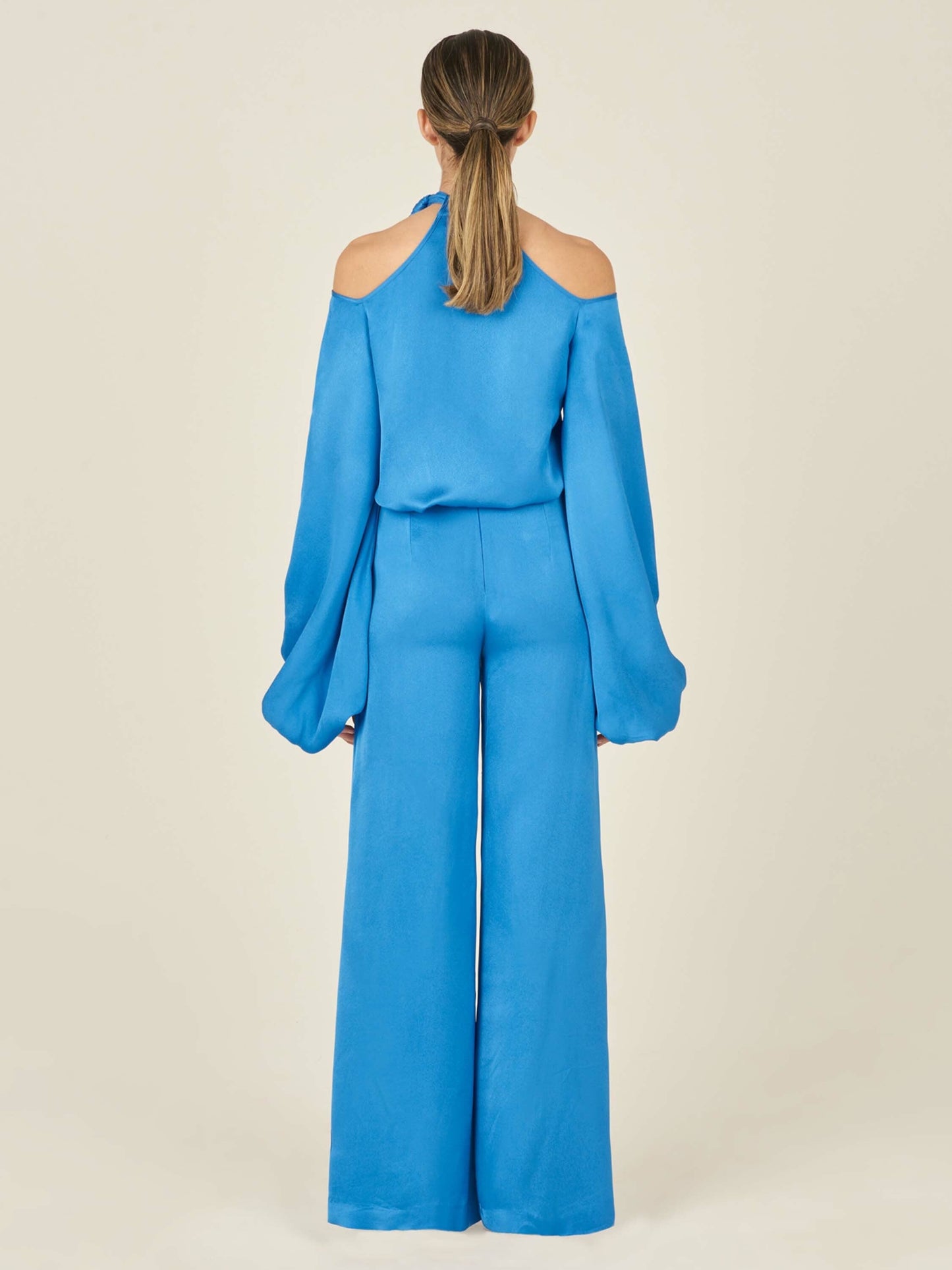 The Ludovica Blouse Blue with a bow on the shoulder, please allow one week for order to ship.