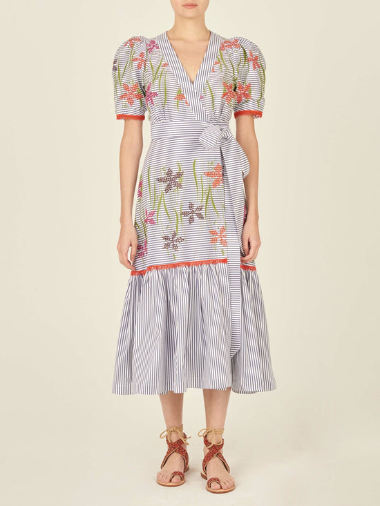 A blue and pink floral embroidered Nicola Dress Blue Pinstripe, featuring an adjustable self-tie waist strap.