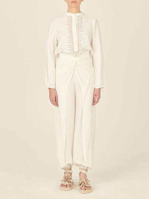 Raimondo Pant White with gathered ankles and a bow-tie detail at the front, isolated on a white background.