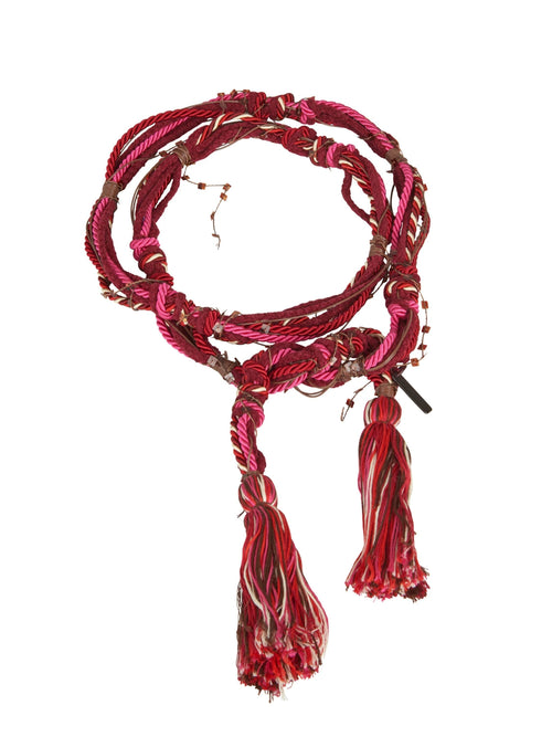 A red tassel necklace with a Nellie Belt Fuchsia hue.