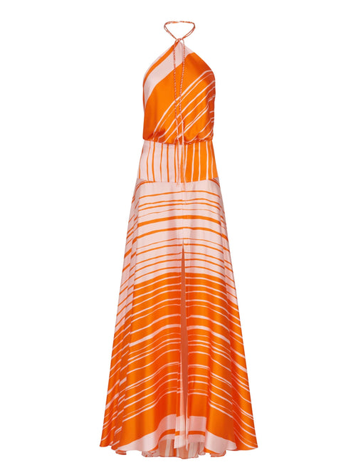 A flattering silhouette of an Agnese Dress Orange Pink with a halter neckline reminiscent of Silvia Tcherassi designs.