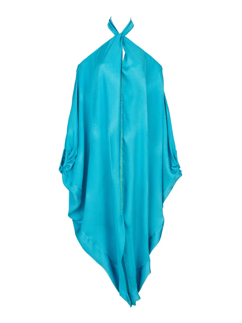 A Jacqueline Kaftan Turquoise with a halter neck and draped design, made from turquoise crepe fabric and featuring loose, flowing material.