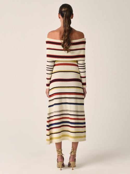 A Brie Skirt Multi Mustard Stripe featuring horizontal bands in cream, yellow, red, navy, and beige on a white background, crafted from 100% baby alpaca.