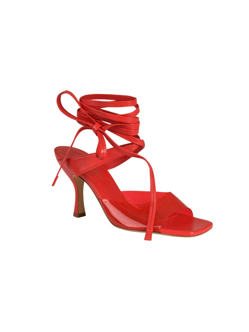 Marlene Heels Red Italian calf leather high-heeled sandal with a PVC transparent strap on a white background.