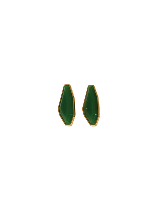 Two Badra Earrings in Emerald, featuring elongated hexagon shapes with gold frames, set against a plain white background.