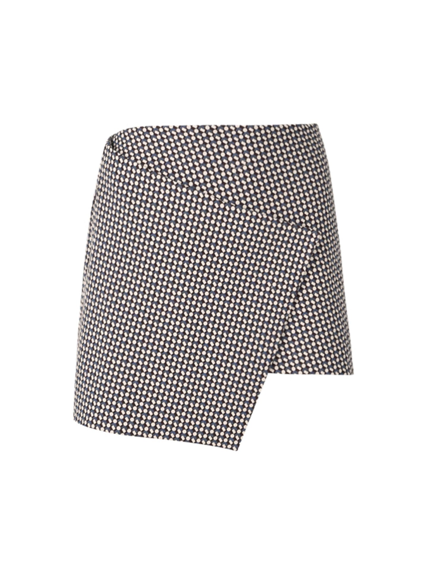 The Aime Skort Celeste Geometric Print features a black and white geometric pattern with a modern silhouette and an asymmetrical hem.