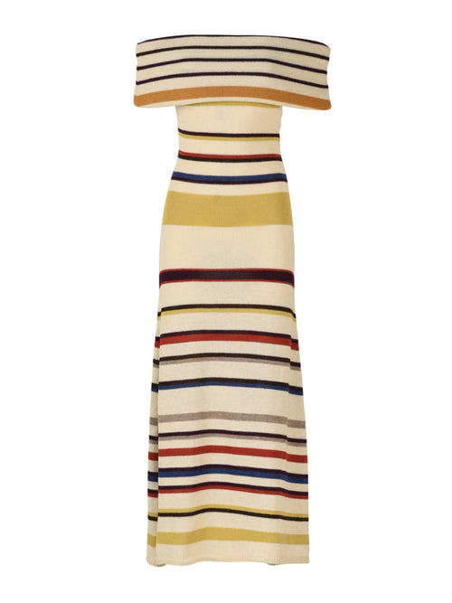 Introducing the Eva Dress Multi Mustard Stripe: a sleeveless, off-the-shoulder marvel crafted from 100% baby alpaca. This form-fitting top flares out slightly at the bottom and features vibrant, multi-colored stripes including yellow, brown, red, and blue.