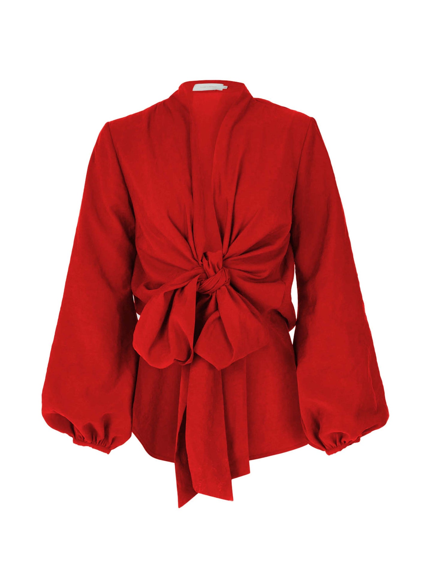 The Honey Blouse Rouge is a vibrant rouge fabric blouse featuring a red long-sleeved design with a large front knot, bishop sleeves with elastic cuffs, and a plunging neckline.