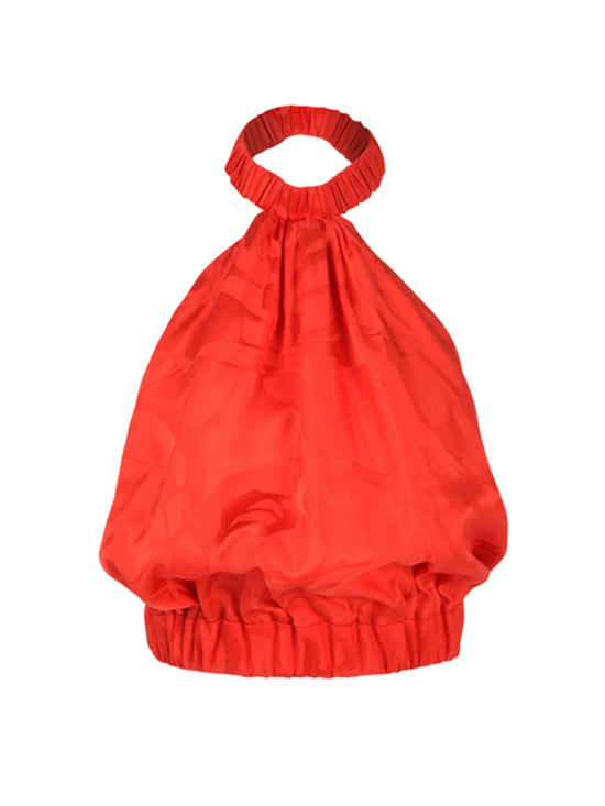 A bright red handbag with ruched fabric, featuring a rounded, gathered top handle and an elasticized opening at the top and bottom, reminiscent of the Tammy Blouse Crimson Jacquard.