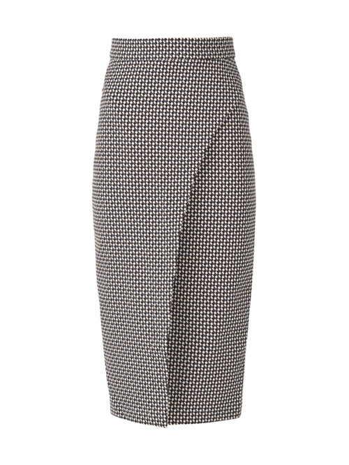 A knee-length, black and white houndstooth pencil skirt with a front overlap detail, seamlessly blending the elegant pencil skirt silhouette from the Resort 2023 collection, Thora Skirt Celeste Geometric Print.