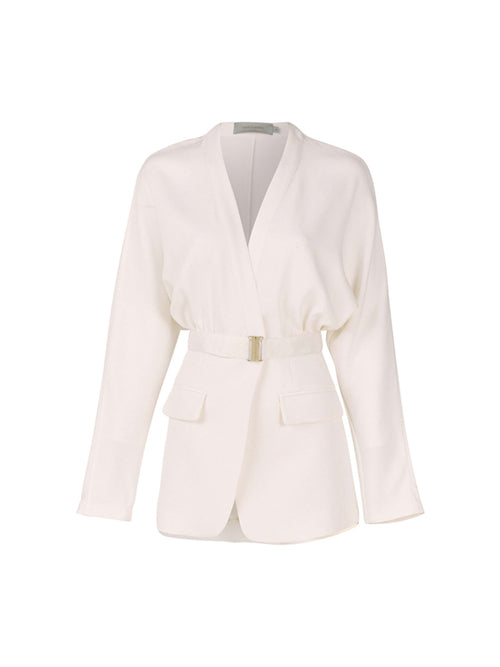 A white belted blazer with long sleeves, two front pockets, and a V-neck collar photographed against a plain background exudes modern elegance. This seasonless sleek white viscose piece, known as the Vogogna Jacket White, is a timeless addition to any wardrobe.