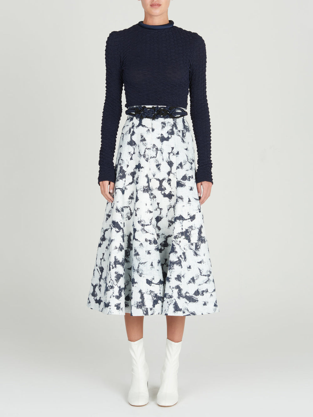 A women's long-sleeved Jari Top Navy, crafted from jacquard fabric, making it a versatile piece for Resort 2024.