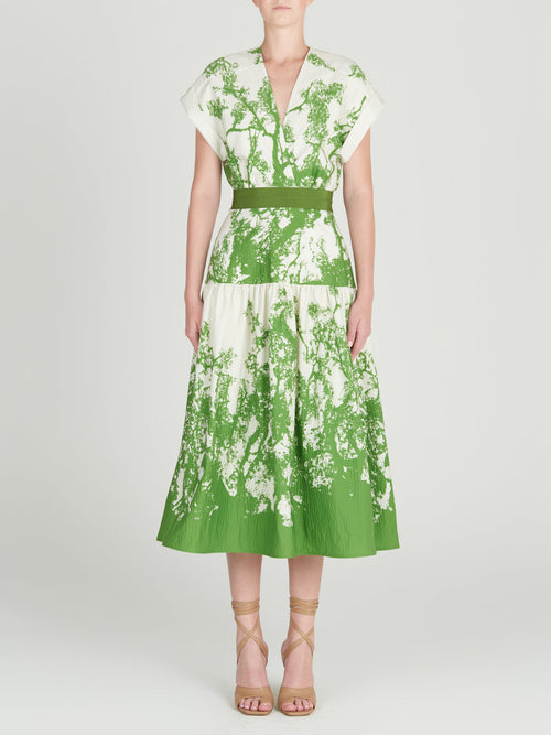 A Metaponto Dress Green Cyprus in a nature-inspired print of green and white florals.