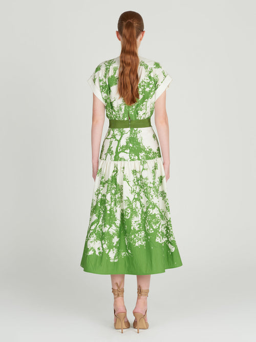 A Metaponto Dress Green Cyprus in a nature-inspired print of green and white florals.