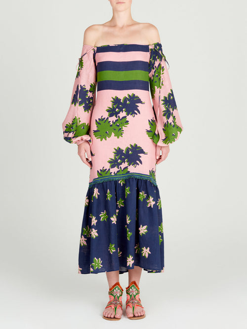 Oristano Dress Navy Pink with off-the-shoulder style and blue and green flowers on it.