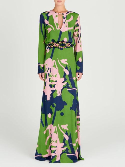 A vibrant printed Ravenna Dress Verdi Pink with a belt.