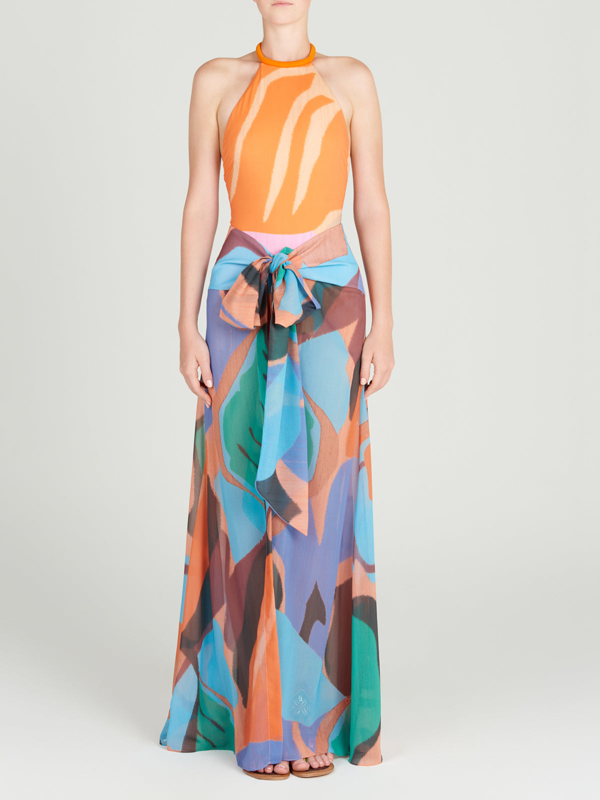 A woman's Cagliari Skirt Pareo Pastel Multi Swirls with a colorful print on it.