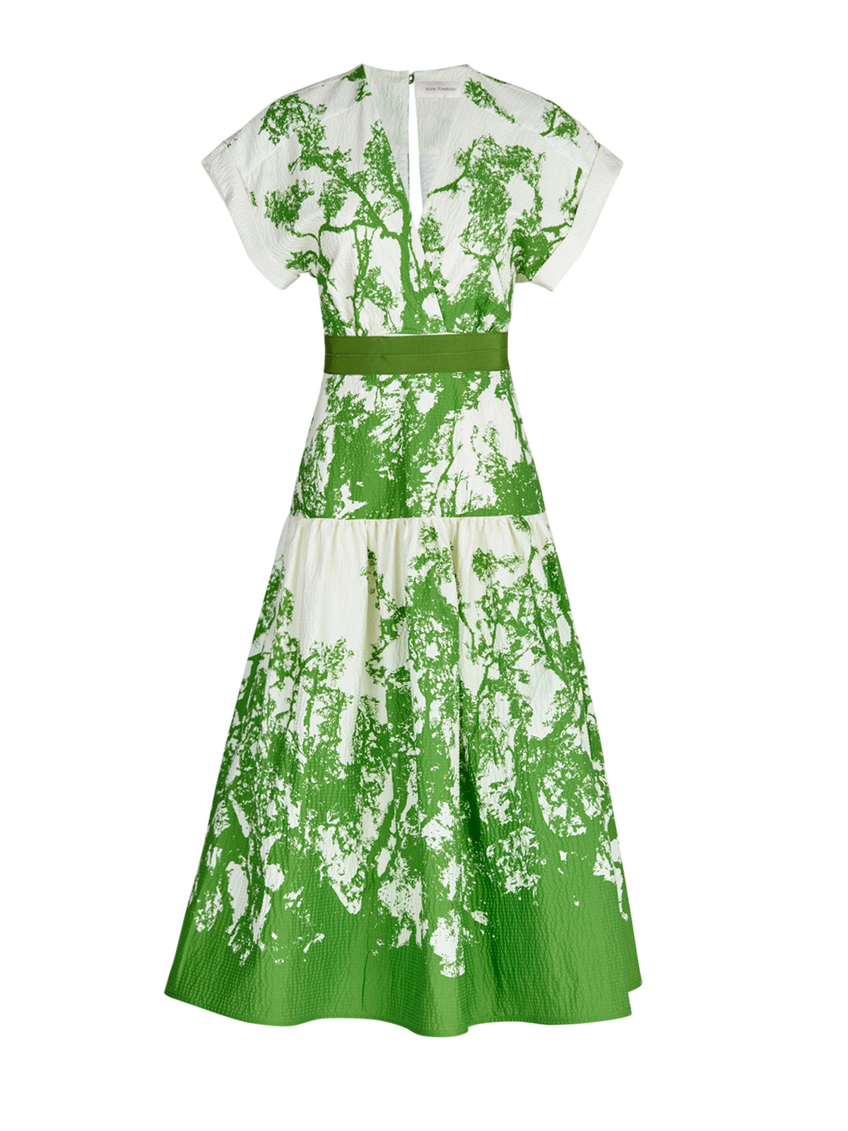 A Metaponto Dress Green Cyprus in a nature-inspired print of green and white florals.