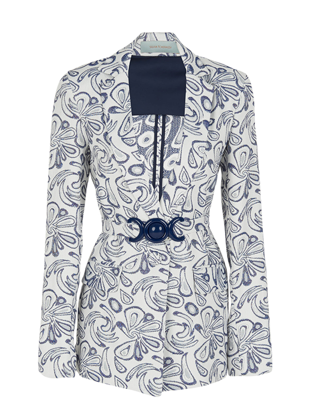 The Cuneo Jacket Swirls is a versatile piece featuring a white and blue patterned design with long sleeves. It showcases a dark blue rectangular panel on the chest and includes a decorative belt with a circular buckle at the waist, making it both stylish and adaptable for various occasions.