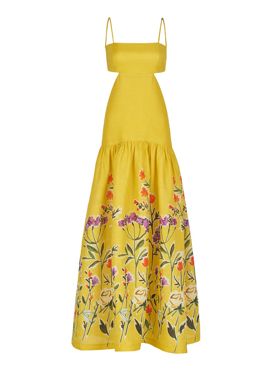 The Shannon Dress Golden Wallflowers is a yellow sleeveless maxi dress with thin straps, boasting a fitted bodice and a flared skirt adorned with colorful floral embroidery near the hem, making it perfect as a vacation maxi dress.