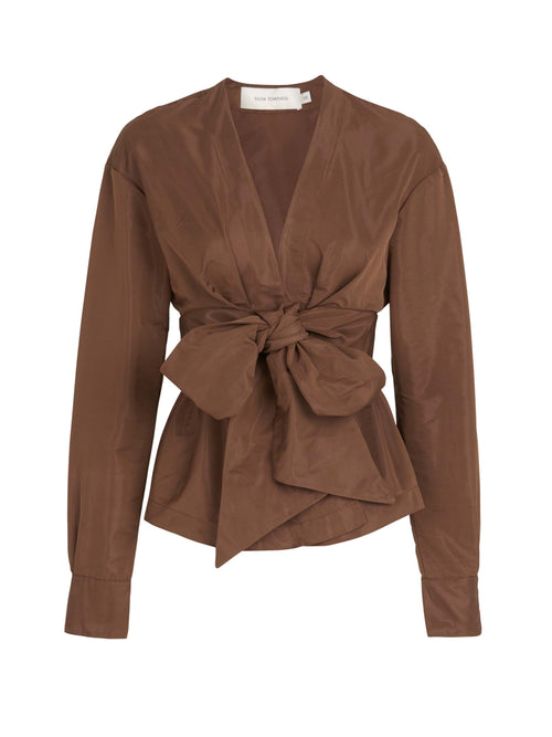 A brown blouse with a bow on the front, in the Saanvi Blouse Brown style.