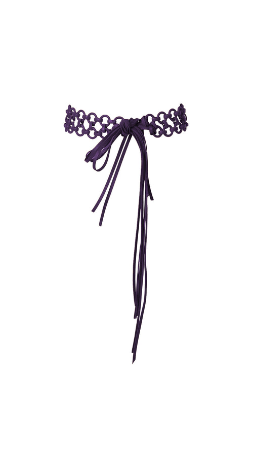 A Sindione Belt Purple with a central bow featuring multiple ribbon strands hanging down, paired perfectly with elegant resin rings.