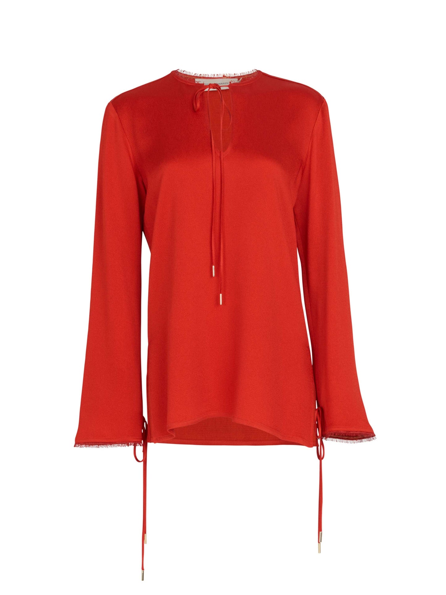 A figure-flattering Zafra Blouse Rouge with lace trim.